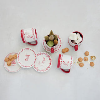 White stoneware holiday mug with red hand-drawn illustrations and contrast rim