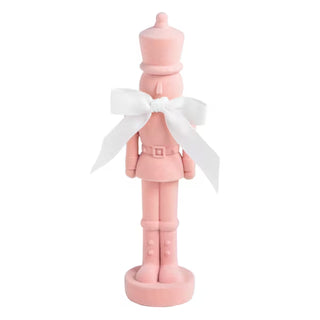 Mud Pie pink flocked nutcracker sitter with cotton bow at neck