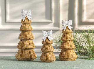 Styled view of Mud Pie wicker-style resin tree sitter in holiday display