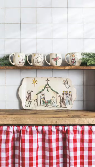 Mud Pie hand-painted speckled stoneware nativity mug with cross, angel, church and manger