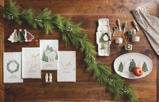 Styled view of Mud Pie white nutcracker shakers