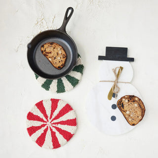 Round tufted cotton candy stripe trivets in red and green with cream