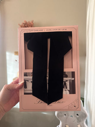 Black velvet bow garland for moody, elegant Halloween mantel decor