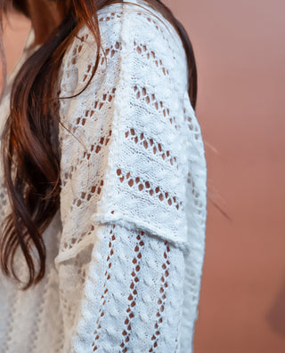 Detail view of Allie Rose off-white pointelle knit sweater