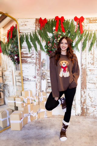 Side view of relaxed knit pullover with long sleeves and dropped shoulders