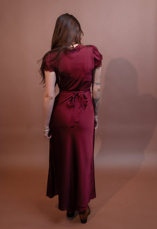 Back view of winter wine satin midi dress with short puff sleeves