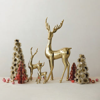 Small cast aluminum reindeer figurine in gold finish with elongated antlers