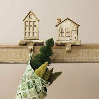 Gold cast aluminum house-shaped stocking holder with tealight feature