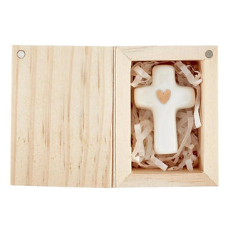 Faith-inspired ceramic cross keepsake displayed as a holiday stocking stuffer