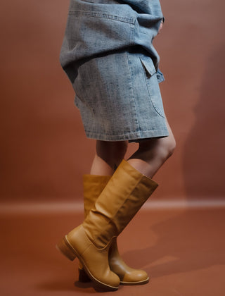 Close-up of the stitched detailing on the camel faux leather boot