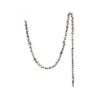 Styled view of champagne boxwood garland draped across a mantel