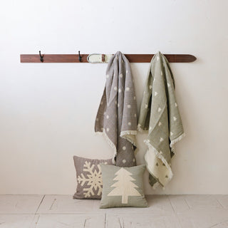 Styled view of sage and natural tree throw