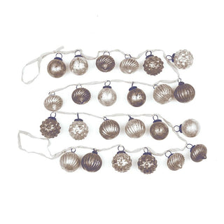 Embossed mercury glass ornament garland in taupe and cream with velvet ribbon