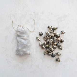 Embossed mercury glass ornaments in holiday shapes with muslin storage bag