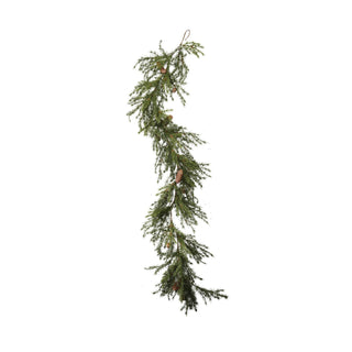 Close-up of natural pinecones on faux cedar holiday garland