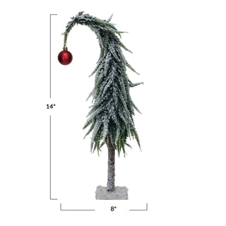 Side view of faux evergreen tree with snow finish and MDF base
