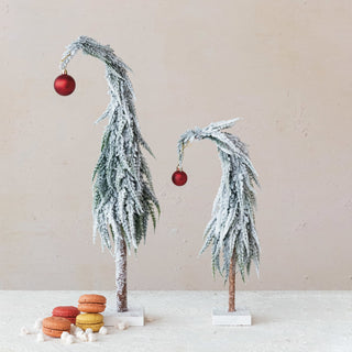 Alternate view of snow-dusted faux evergreen tree with red ornament