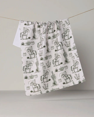 Cowboy Claus holiday print tea towel in absorbent quick-drying fabric