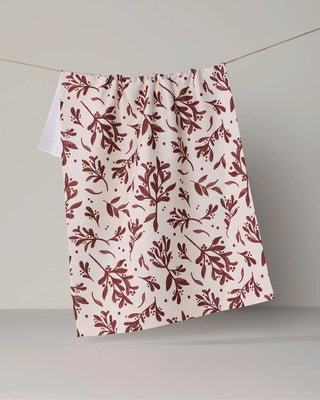 Holly Folly print tea towel in quick-drying woven fabric