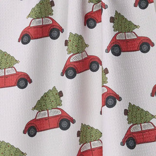 Styled view of Merry Miles Christmas tea towel