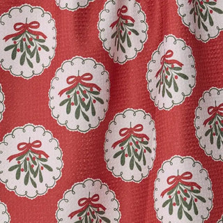 Styled view of Merry Mistletoe Christmas tea towel