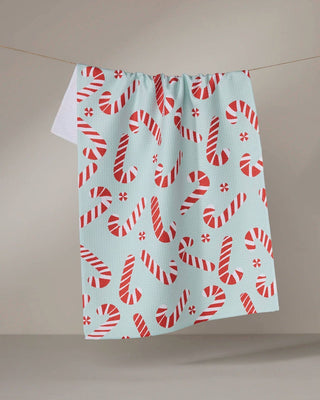 Peppermint Twist holiday print tea towel in quick-drying woven fabric