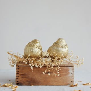 Alternate view of golden songbird figurine with softly rounded form
