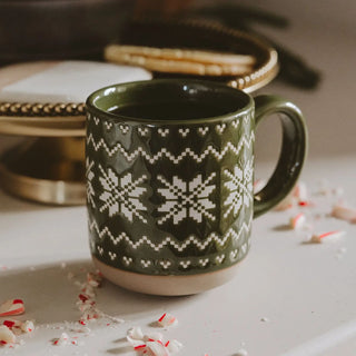 Green glazed stoneware coffee mug with embossed Fair Isle sweater pattern
