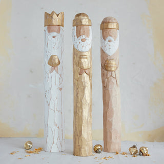 Close-up of distressed hand-painted finish on wooden nativity Wiseman