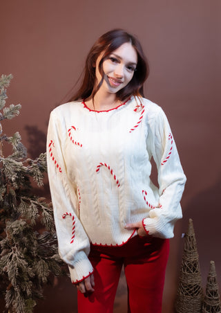Close-up of the candy cane patch on Hem & Thread cable knit sweater