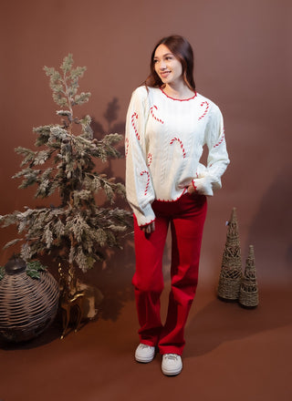Styled view of Hem & Thread candy cane sweater