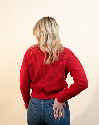 Styled view of Hem & Thread cranberry cardigan