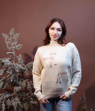 Close-up of deer motif on Hem & Thread ecru pullover sweater