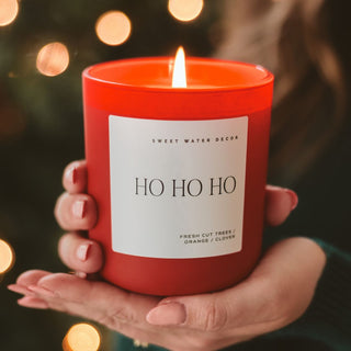 Ho Ho Ho soy candle in red matte glass jar with wood lid