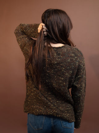Close-up of the speckled knit texture on the brown confetti sweater