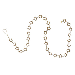 Close-up of glass beads and faux pearl accents on gold star garland