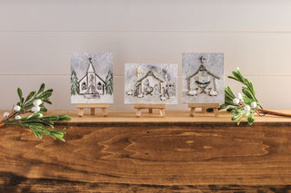 Styled view of Mud Pie church art for faith-inspired Christmas decor