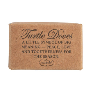 Close-up of Mud Pie pocket-sized ceramic turtledove holiday keepsake