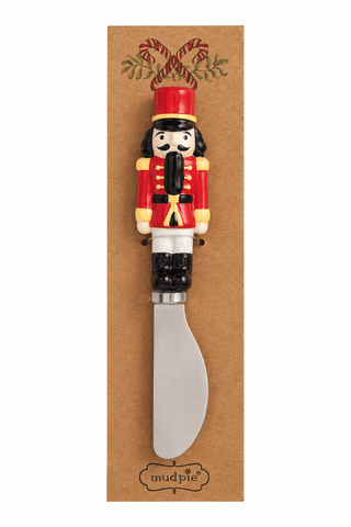 Detail view of hand-painted ceramic figural handle on Mud Pie spreader