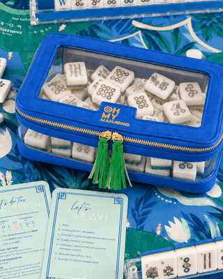 Blue structured mahjong tile storage bag with clear panels and zip closure