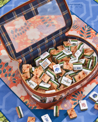 Heritage mahjong tile set with white faces and sage and olive layered edges
