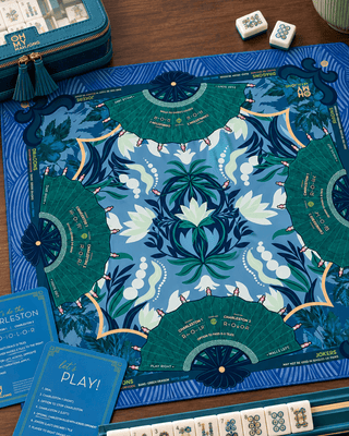 Jade neoprene mahjong mat with deep blue tones, green florals and fan motifs