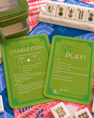 Set of two olive mahjong tile shufflers with rules printed on the sides