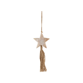 Styled view of oversized wood star ornament with jute tassel