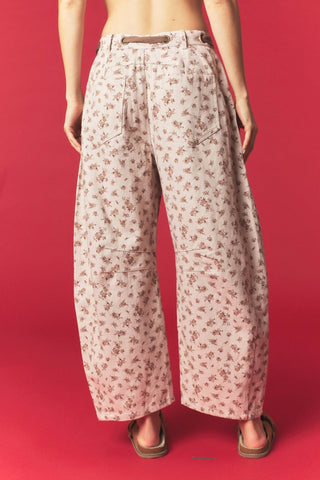Close-up of waist bow tie detail on Bambi print barrel pants
