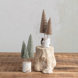 Glittered bottle brush trees on natural wood bases in green and gold