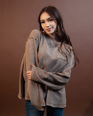 Close-up of contrast seams and thermal texture on POL choco top