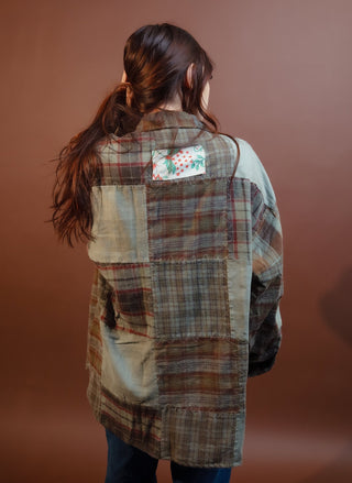 Side view of POL long olive woven jacket on model