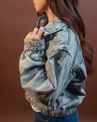Back view of POL Prairie Bloom cropped denim floral jacket