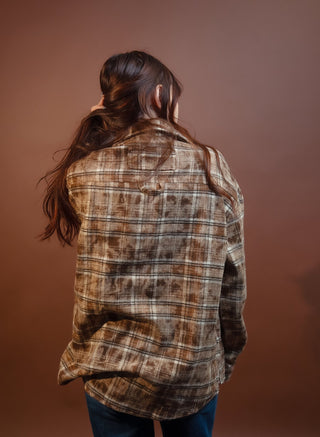 Close-up of POL chocolate brown plaid woven fabric